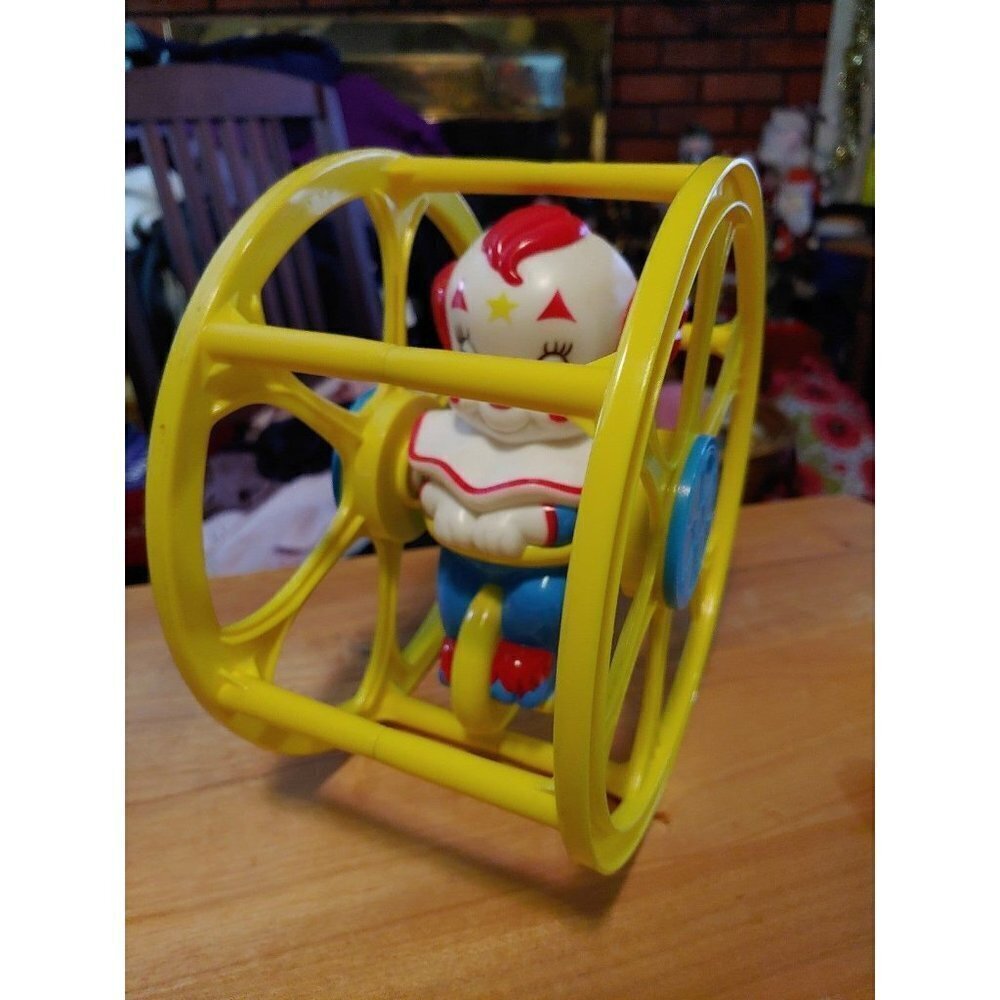 Vintage Bozo the Clown Rolling Wheel Baby Toy